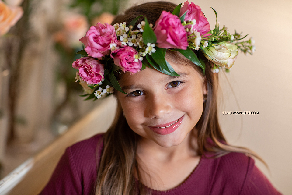 Little girl smiling with her flower crown on in Vero Beach Florida