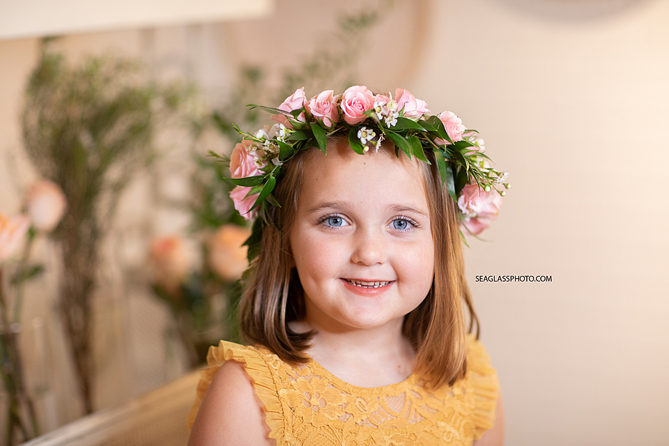 Girl smiles with her flower crown in Vero Beach Florida