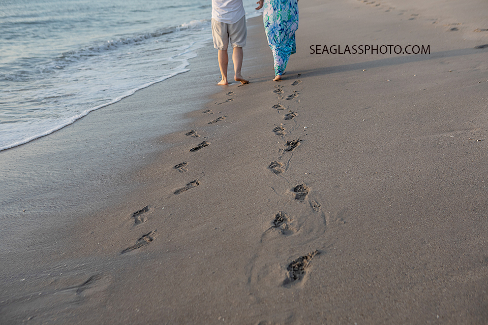 parents footprints in the sand at colorful sunrise on the beach at Disney Vero Beach Resort by Seaglass Photography