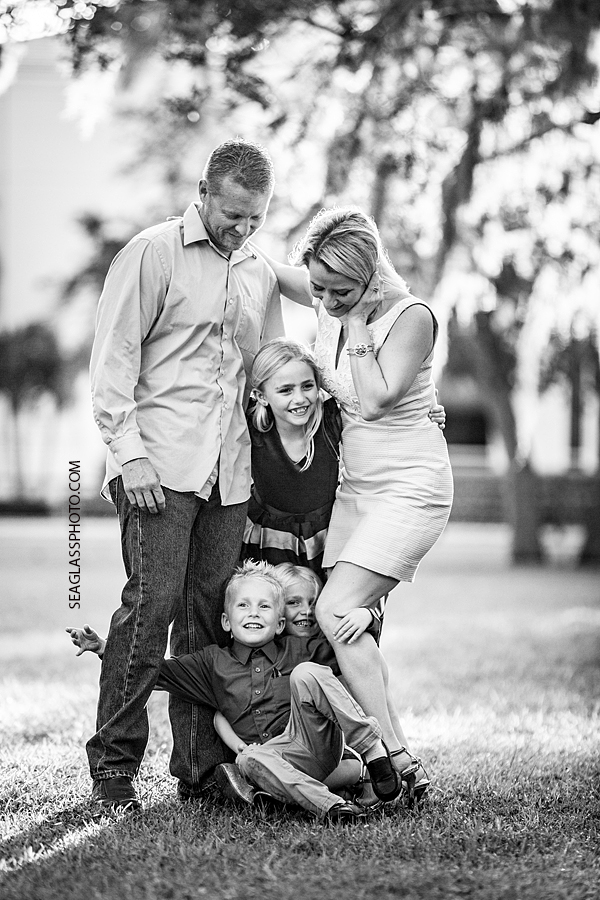Black and white fun family photo fun family photo wearing blue dress at rivierside park in Vero Beach Florida by Seaglass Photography