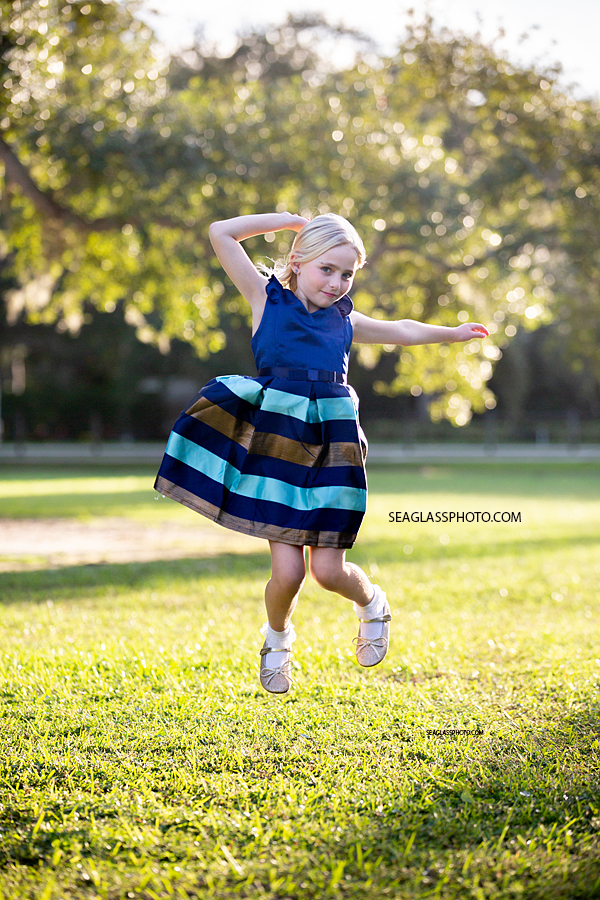 fun family photo wearing blue dress at Riverside park in Vero Beach Florida by Seaglass Photography