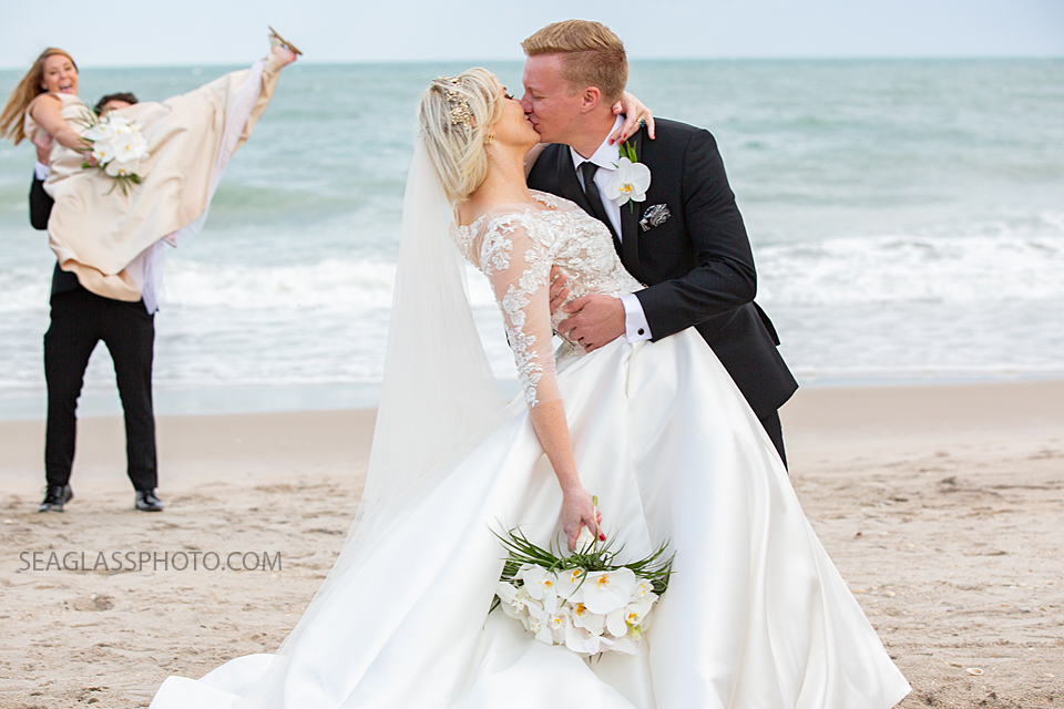 bride and groom kissing on the beach Wedding-CostadEste-Disney-Family-Vero-Beach-Photographer-Windsor-