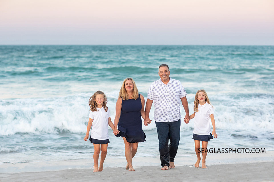Vero Beach Family playing in the water on the beach at sunset wearing navy and white 32963