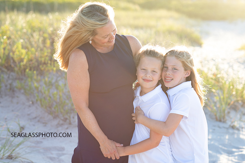 mother and daughters wearing navy and white Vero Beach Florida