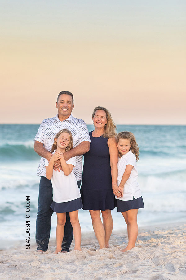 Vero Beach Family portrait on the beach at sunset wearing navy and white 32963