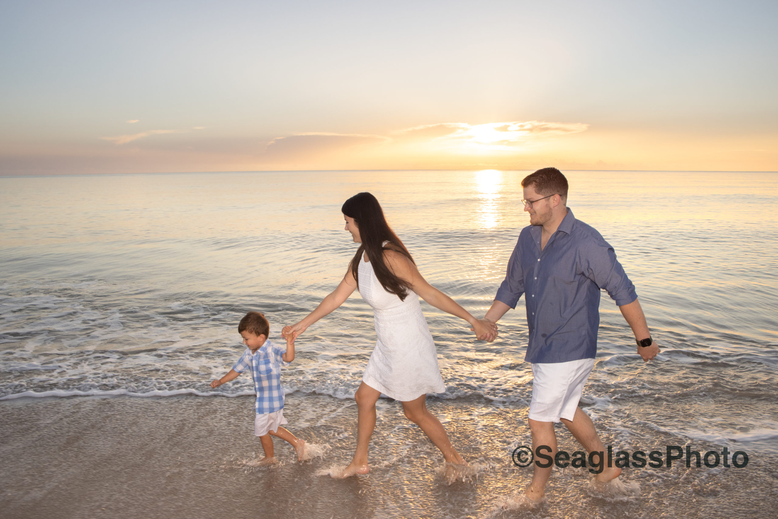 family running on the beach at sunrise at the Disney Vero Beach Resort