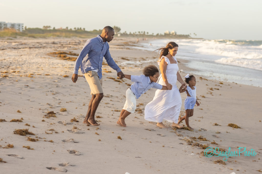 family walking toward the ocean in Vero Beach Florida 