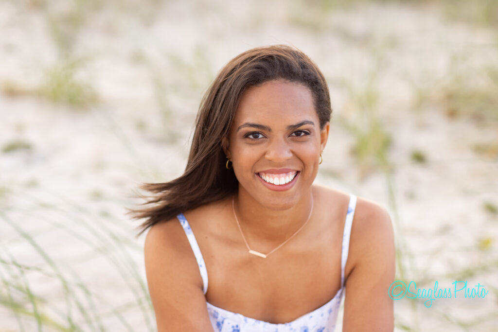 portrait of high school senior girl in the sand dunes with seagrass Vero Beach Florida 