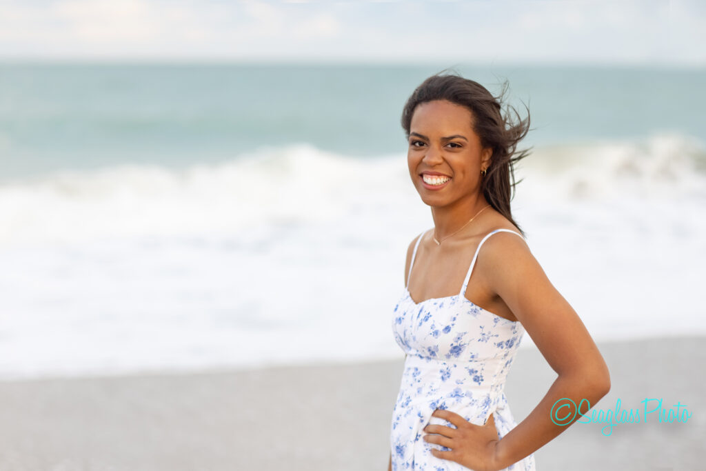 portrait of high school senior girl standing by the ocean in Vero Beach Florida 