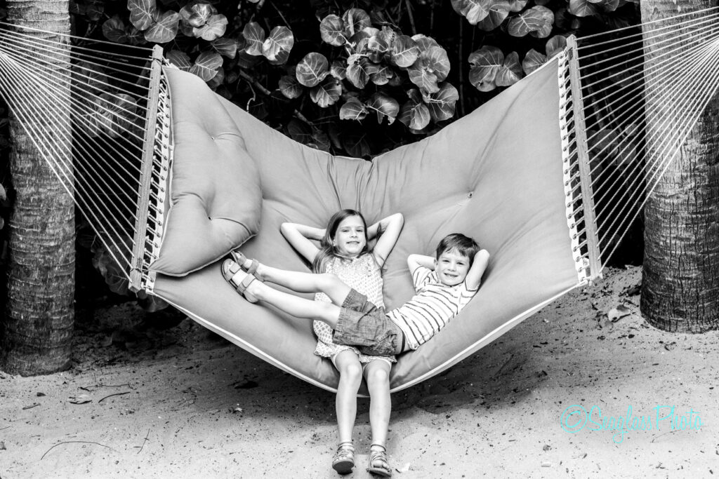 Black and white photo of kids on the hammock at Disney Vero Beach resort in Florida 