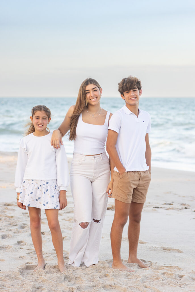 portait of siblings by the ocean at sunset in Vero Beach Florida