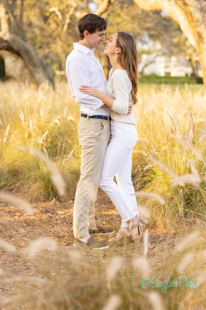 newly engaged couple hugging each other standing in pampas grass in Vero Beach Florida 