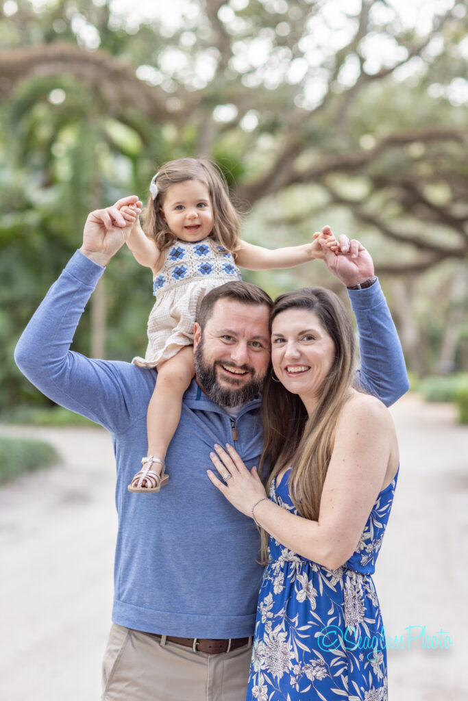 Family Portrait in Vero Beach Florida with the toddler girl sitting on dad's shoulders