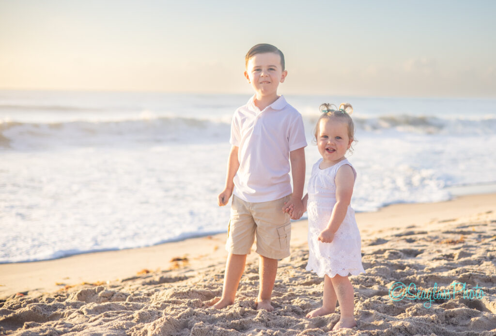 Vero Beach siblings on the beach wearing white for a family photoshoot at sunrise 