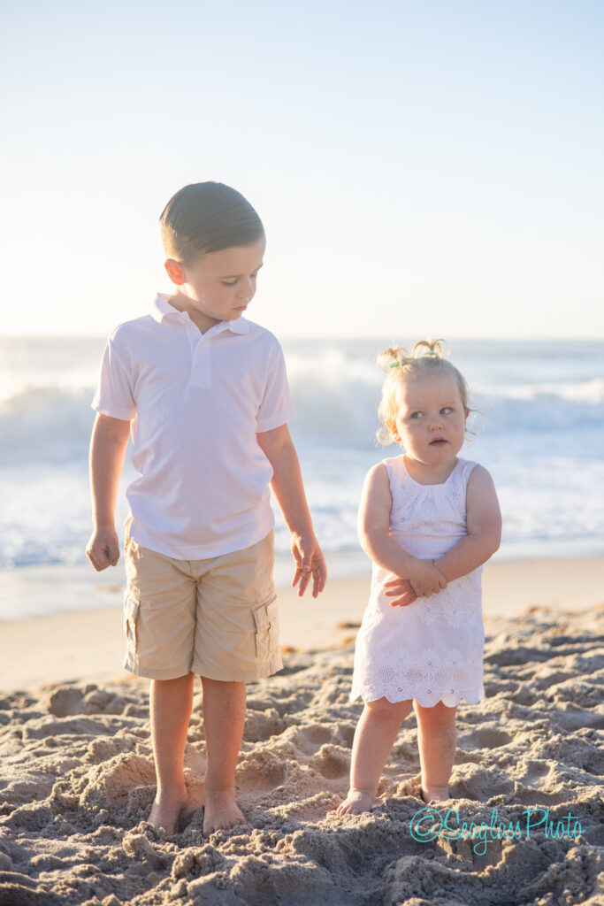 Vero Beach siblings on the beach wearing white for a family photoshoot at sunrise 