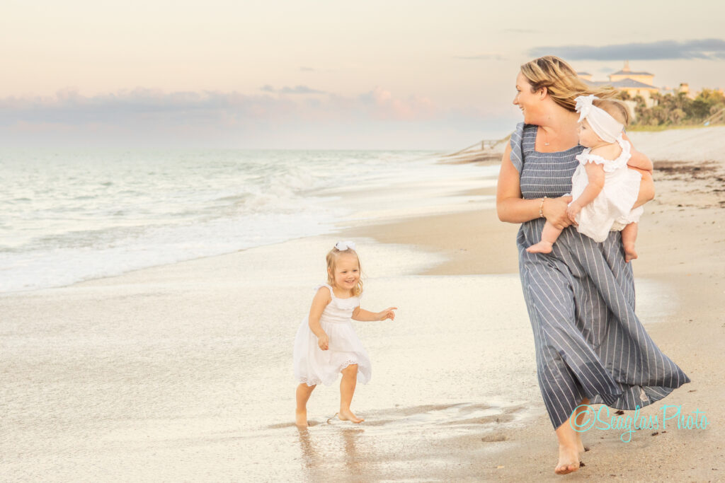 photoshoot at Disney Vero Beach Resort of mother and daughter running down the beach 