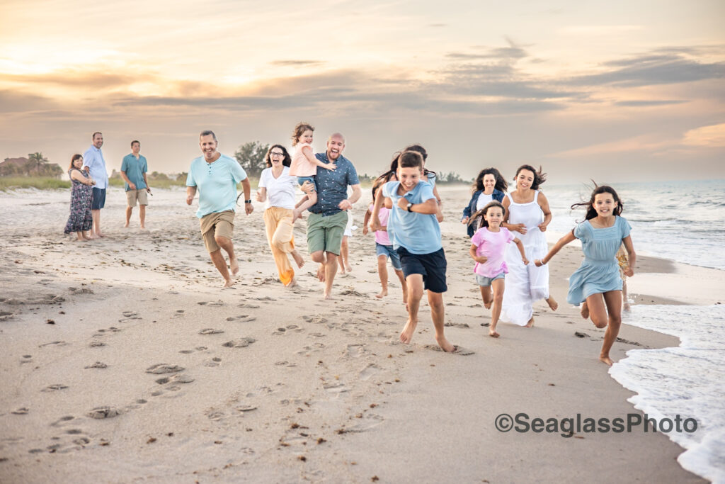 grandparents and grandkids running down the beach at sunset in Vero Beach Florida 