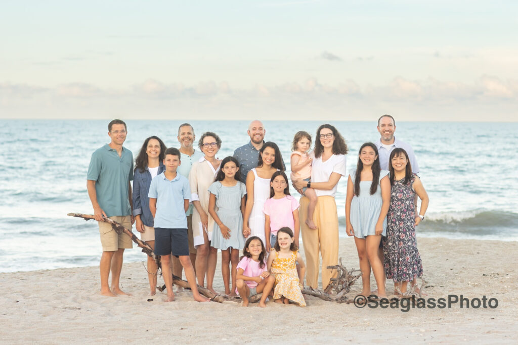 family on the beach at sunset wearing colorful clothing in Vero Beach Florida staying at VRBO White Surf