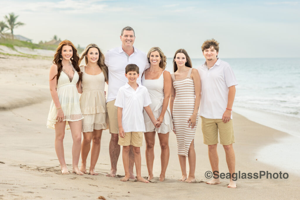 family portrait in Vero Beach Florida wearing a mix of white, khaki and cream