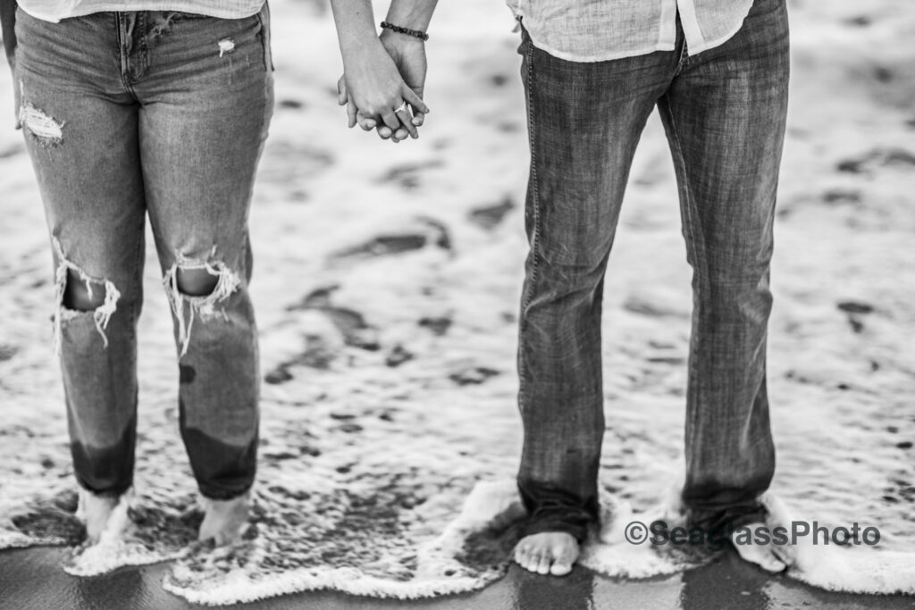 black and photo close up of engaged couple standing in the ocean water in Vero Beach 