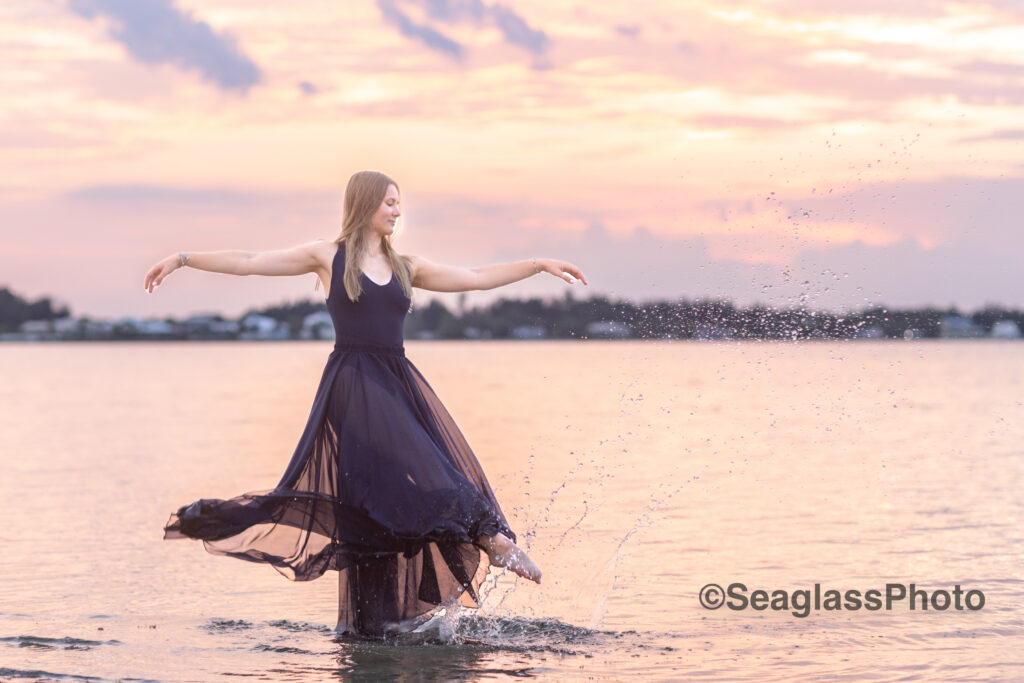 dancer splashing in the river at sunset in Vero Beach near the Disney Resort