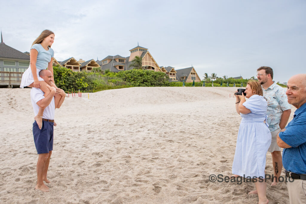 a fun father and daughter photo with the Vero Beach Disney Resort in the background