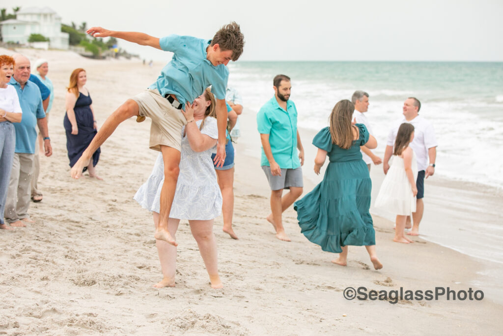 fun family reunion with teen boy jumping into the arms of his cousin in Vero Beach Florida 